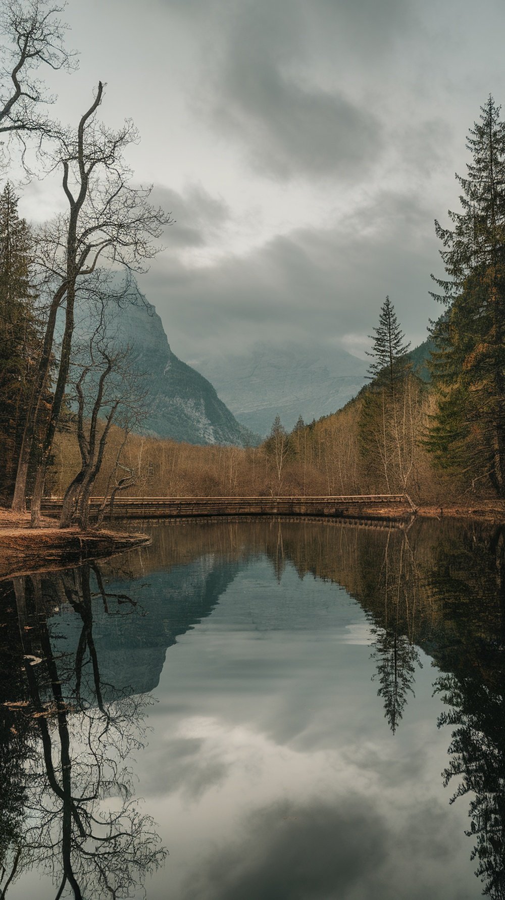 A cozy modern boho living room featuring cane furniture and warm lighting.